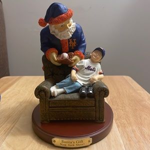 NY Mets Christmas figurine. Santa Claus and child.
